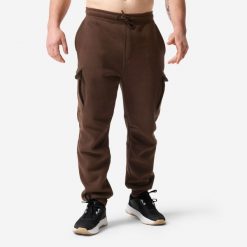Spodnie fitness męskie Domyos. Brązowe spodnie sportowe męskie DOMYOS, z materiału. Za 149.99 zł.