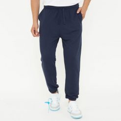 Spodnie sportowe unisex F BALLON niebieskie. Niebieskie spodnie sportowe damskie Legea, z gumy, na fitness i siłownię. W wyprzedaży za 92.00 zł.