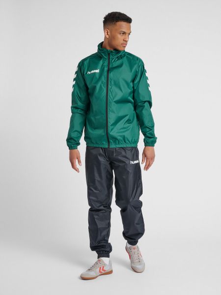 Kurtka ortalionowa sportowa dla dorosłych Hummel Core Spray Jacket. Zielone kurtki treningowe męskie HUMMEL, m, bez wzorów, z materiału, do piłki ręcznej. Za 80.00 zł.