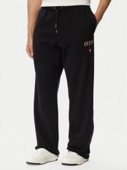 Guess Jeans Spodnie dresowe M6YB15 K4842 Czarny Regular Fit. Czarne spodnie dresowe męskie Guess Jeans, z aplikacjami, z bawełny. Za 299.99 zł.
