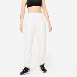 Spodnie dresowe damskie Domyos Gym & Pilates 500. Białe spodnie dresowe damskie DOMYOS, s, z bawełny, na fitness i siłownię. W wyprzedaży za 79.99 zł.