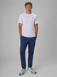 4F Spodnie casual joggery męskie - denim XL. Niebieskie spodnie materiałowe męskie 4f, bez wzorów, z bawełny, casualowe, z standardowym stanem. Za 179.99 zł.