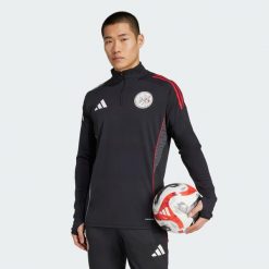 Koszulka treningowa Ajax Tiro 25 Competition. Białe t-shirty sportowe męskie Adidas, m, z dresówki, bez ramiączek, do piłki nożnej. Za 399.96 zł.