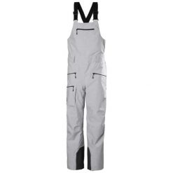 Kombinezon narciarski damski z szelkami Helly Hansen Powderqueen 2.0. Szare kombinezony damskie Helly Hansen, na zimę, bez wzorów, sportowe, bez kołnierzyka, bez ramiączek. Za 1,188.65 zł.