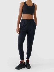 Spodnie treningowe z wykończeniem szybkoschnącym damskie 4F Czarny XS. Czarne spodnie materiałowe damskie Under Armour, bez wzorów, z elastanu. Za 179.99 zł.