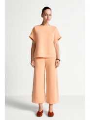 Rich & Royal Spodnie w kolorze pomarańczowym rozmiar: M. Pomarańczowe spodnie materiałowe damskie Rich & Royal, bez wzorów, z materiału. Za 179.95 zł.