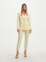 Garniturowe spodnie - żółty. Żółte spodnie materiałowe damskie Reserved, bez wzorów, z dzianiny. W wyprzedaży za 49.99 zł.
