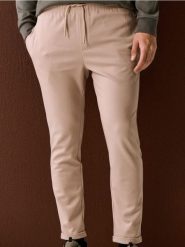 Spodnie dresowe jogger z domieszką wiskozy - beżowy. Brązowe spodnie sportowe męskie Sinsay, z dresówki. Za 49.99 zł.