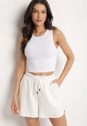 Biały Krótki Tank Top z Prążkowanej Tkaniny Nevallia. Białe topy damskie Born2be, l, bez wzorów, z jeansu, bez kołnierzyka. Za 29.99 zł.