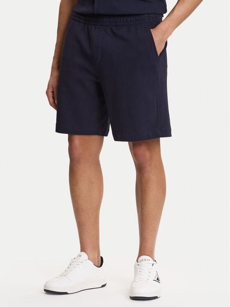 Guess Szorty sportowe M6GD16 K3088 Granatowy Regular Fit. Niebieskie szorty męskie Guess, z aplikacjami, z bawełny, sportowe. Za 344.99 zł.