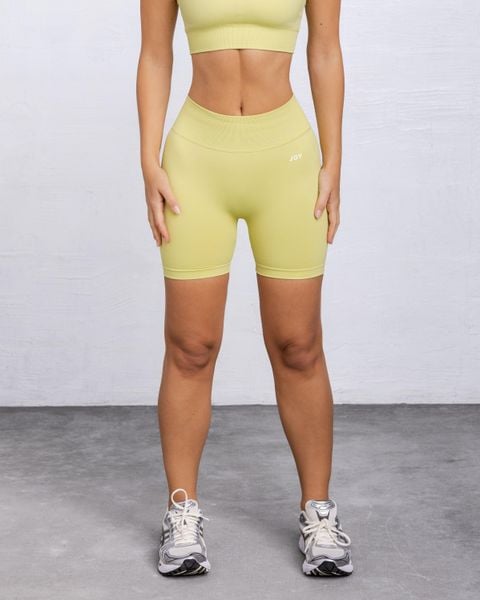 Szorty Sculpt Scrunch - Żółty. Żółte spodenki sportowe damskie JOY STUDIO, l, z materiału, na fitness i siłownię. Za 168.00 zł.