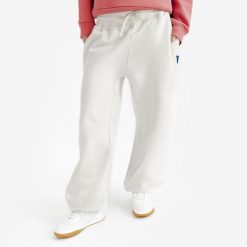 Spodnie damskie Elementals. Brązowe spodnie materiałowe damskie Decathlon, bez wzorów, z bawełny. Za 149.99 zł.
