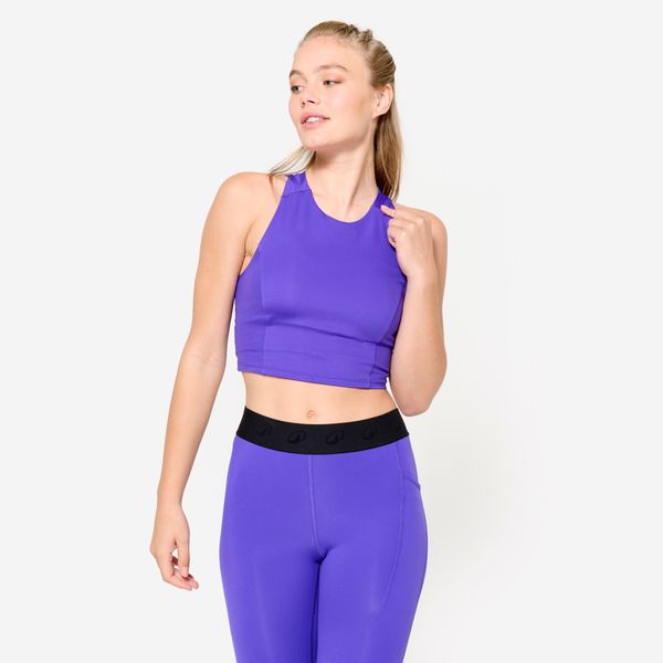 Koszulka fitness damska Domyos crop top bez rękawów. Fioletowe bluzki sportowe damskie DOMYOS, l, bez wzorów, z elastanu, bez kołnierzyka. W wyprzedaży za 49.99 zł.