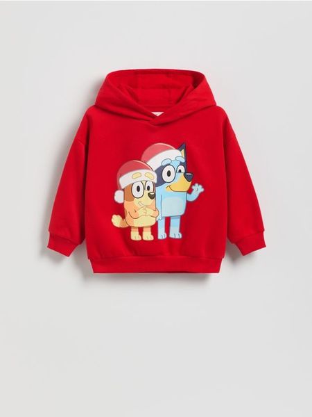 Bluza Bluey - czerwony. Czerwone bluzy i bluzki niemowlęce Reserved, bez wzorów, z bawełny, bez ramiączek, bez kaptura. Za 59.99 zł.
