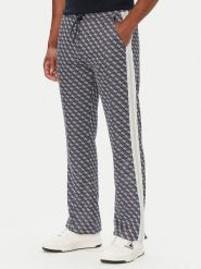 Guess Spodnie dresowe Z5BB07 K2042 Granatowy Regular Fit. Niebieskie spodnie dresowe męskie Guess, z aplikacjami, z dresówki. Za 524.99 zł.