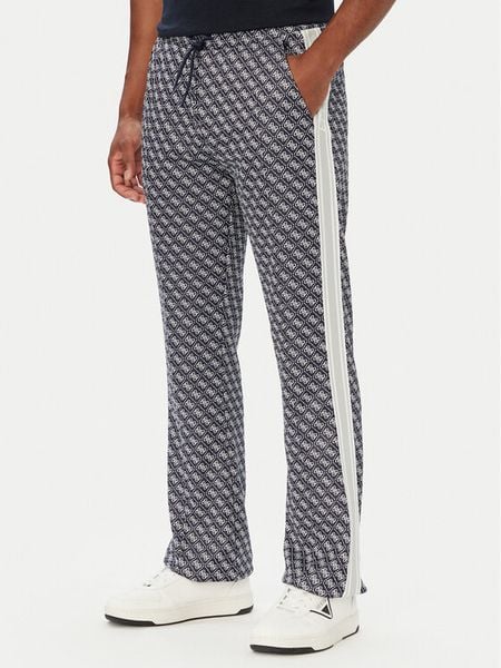 Guess Spodnie dresowe Z5BB07 K2042 Granatowy Regular Fit. Niebieskie spodnie dresowe męskie Guess, z aplikacjami, z dresówki. Za 524.99 zł.