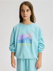 Bawełniana koszulka z nadrukiem - jasnoturkusowy. Niebieskie koszulki dziewczęce Reserved, bez wzorów, z bawełny, bez ramiączek. Za 59.99 zł.