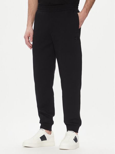 Armani Exchange Spodnie dresowe XM000744 AF13047 UC001 Czarny Regular Fit. Czarne spodnie dresowe męskie Armani Exchange, bez wzorów, z bawełny. Za 299.99 zł.