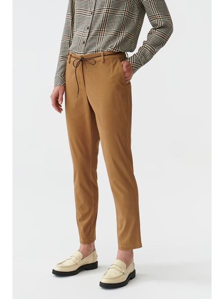 TATUUM Spodnie w kolorze jasnobrązowym rozmiar: 40. Brązowe spodnie materiałowe damskie Tatuum, bez wzorów, z materiału. Za 100.75 zł.