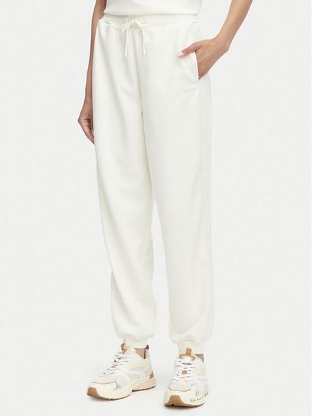 Guess Spodnie dresowe V6YB09 K4292 Kremowy Regular Fit. Białe spodnie dresowe damskie Guess, l, z aplikacjami, z dresówki. Za 394.99 zł.