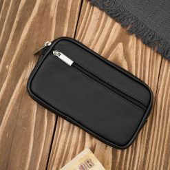 Męska skórzana saszetka na pasek do ręki czarna ABR-53. Czarne paski męskie bez wzorów, ze skóry. Za 57.81 zł.