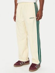 Adidas Spodnie dresowe Cutline Track Tracksuit Bottoms KW8021 Kremowy Regular Fit. Białe spodnie dresowe męskie Adidas, bez wzorów, z dresówki. Za 329.99 zł.