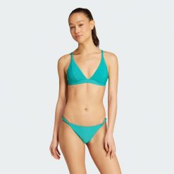 Prążkowana góra bikini Iconisea z wyjmowanymi wkładkami i trójkątnym krojem. Niebieskie bikini damskie Adidas, bez wzorów. Za 179.00 zł.