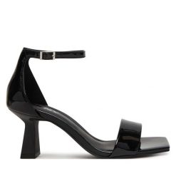 Sandały DKNY. Czarne sandały damskie DKNY, bez wzorów, bez obcasa, na słupku. Za 579.99 zł.