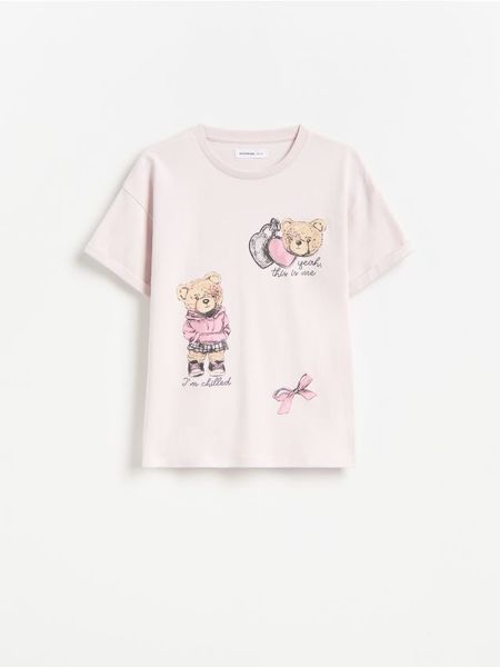 Bawełniany t-shirt z nadrukiem - lawendowy. Fioletowe koszulki dziewczęce Reserved, bez wzorów, z bawełny, bez ramiączek. Za 39.99 zł.