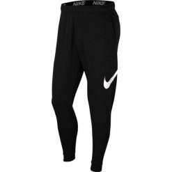 Spodnie treningowe damskie Nike Taper. Czarne spodnie sportowe damskie Nike, s, z materiału, na fitness i siłownię. Za 209.15 zł.