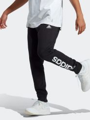Adidas Spodnie dresowe w kolorze czarnym rozmiar: 48. Czarne spodnie dresowe męskie Adidas, bez wzorów, z dresówki. Za 92.21 zł.