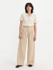 Levi's Spodnie w kolorze beżowym rozmiar: W27/L30. Brązowe spodnie materiałowe damskie Levi's, bez wzorów, z materiału, z podwyższonym stanem. Za 161.95 zł.