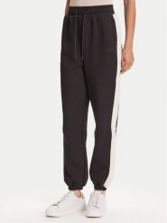 Guess Spodnie dresowe V5YB02 KB3P2 Czarny Regular Fit. Czarne spodnie dresowe damskie Guess, s, z aplikacjami, z dresówki. Za 189.99 zł.