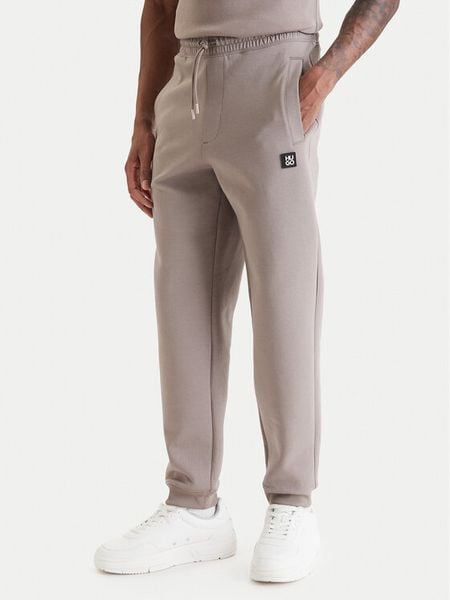 HUGO Spodnie dresowe Dimacs 50533695 Beżowy Relaxed Fit. Brązowe spodnie dresowe męskie Hugo, bez wzorów, z bawełny. Za 509.99 zł.