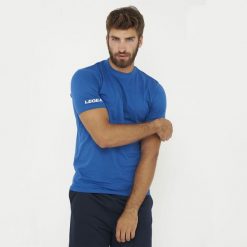 Koszulka Bawełniana ARIA Niebieska. Niebieskie bluzki sportowe damskie Legea, z bawełny, bez kołnierzyka, bez ramiączek. Za 52.00 zł.