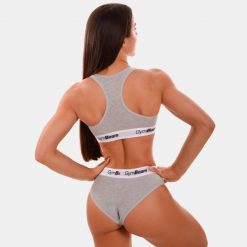 Biustonosz damski fitness z szerokimi ramiączkami szary Braletka. Szare biustonosze sportowe damskie GYMBEAM, bez wzorów, z bawełny. Za 55.90 zł.