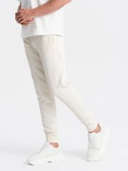 Bawełniane męskie dresowe spodnie joggery BASIC – kremowe V5 OM-PABS-0174 - XXL. Białe spodnie dresowe męskie Ombre Clothing, z bawełny. Za 119.99 zł.