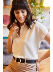 Olalook Bluzka "Olalook" w kolorze kremowym rozmiar: M. Brązowe bluzki damskie Olalook, m, bez wzorów, z wiskozy, bez kołnierzyka, bez ramiączek. Za 69.75 zł.