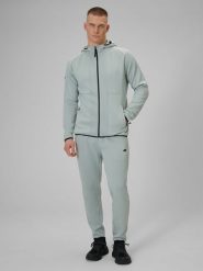 4F Spodnie treningowe szybkoschnące męskie - miętowe M. Niebieskie spodnie materiałowe męskie 4f, bez wzorów, z materiału, biznesowe. Za 199.99 zł.