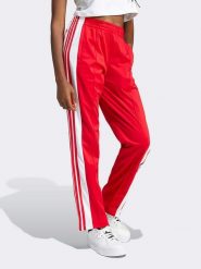 Adidas Spodnie dresowe w kolorze czerwonym rozmiar: XL. Czerwone spodnie dresowe damskie Adidas, xl, bez wzorów, z dresówki. Za 208.83 zł.