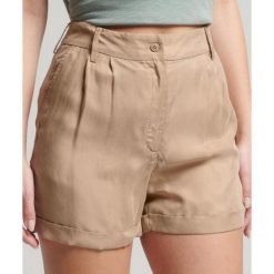 Spodenki turystyczne damskie Superdry Studios Cupro. Brązowe szorty damskie Superdry., bez wzorów, z materiału, z podwyższonym stanem. Za 129.49 zł.