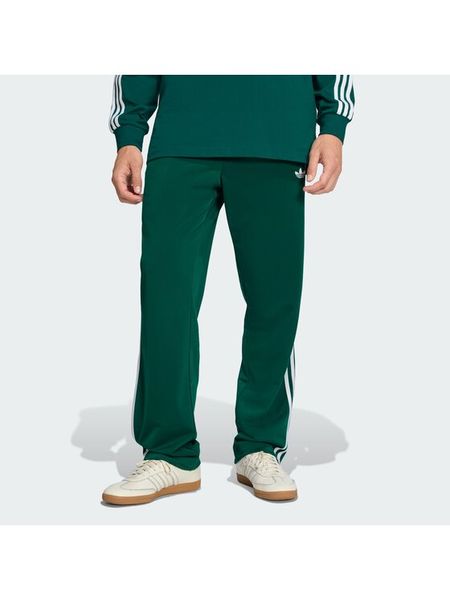 Adidas Spodnie dresowe Firebird KD8317 Zielony Loose Fit. Zielone spodnie dresowe męskie Adidas, bez wzorów, z dresówki. Za 279.99 zł.