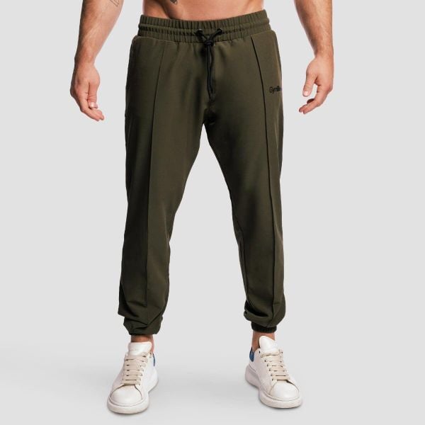 Spodnie męskie fitness jogger oliwkowe ARC. Zielone spodnie sportowe męskie GYMBEAM, z elastanu. Za 127.90 zł.