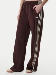 Adidas Spodnie dresowe Firebird KG3706 Brązowy Loose Fit. Brązowe spodnie dresowe damskie Adidas, xl, bez wzorów, z dresówki. Za 299.99 zł.