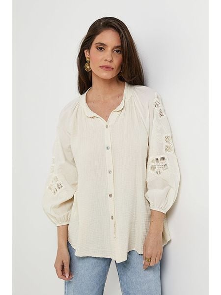 Rodier Lin Lniana bluzka w kolorze kremowym rozmiar: M/L. Brązowe bluzki damskie Rodier Lin, l, bez wzorów, z koronki, bez kołnierzyka, bez ramiączek. Za 158.47 zł.