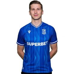 Koszulka piłkarska Macron Lech Poznań 24/25. Białe t-shirty sportowe męskie Macron, m, z materiału, bez ramiączek, do piłki nożnej. Za 249.99 zł.