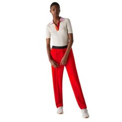 Spodnie damskie Lacoste. Czerwone spodnie sportowe damskie Lacoste, xs, z dresówki. Za 437.00 zł.