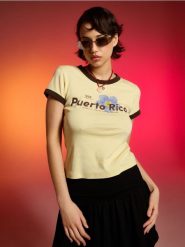 Bawełniana koszulka z napisem Puerto Rico - yellow jeans. Żółte t-shirty damskie Sinsay, l, bez wzorów, z bawełny, bez kołnierzyka. Za 19.99 zł.
