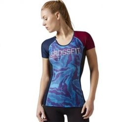 Koszulka treningowa damska Reebok Compression. Niebieskie t-shirty damskie Reebok, l, bez wzorów, z materiału, bez kołnierzyka. Za 309.00 zł.