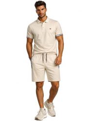 Geographical Norway Koszulka polo "Koliar" w kolorze beżowym rozmiar: S. Brązowe koszulki polo męskie Geographical Norway, s, bez wzorów, z bawełny, bez ramiączek. Za 83.42 zł.